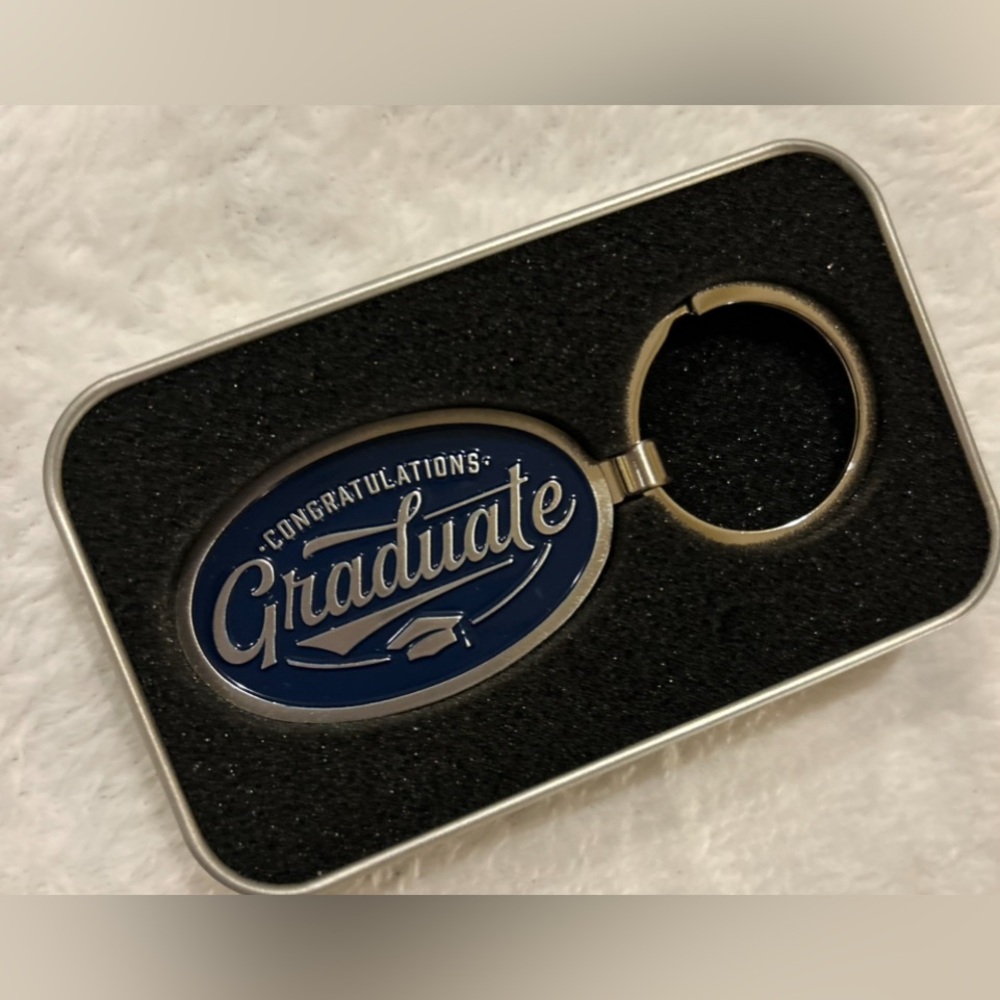 Metal tin with keychain for the graduate